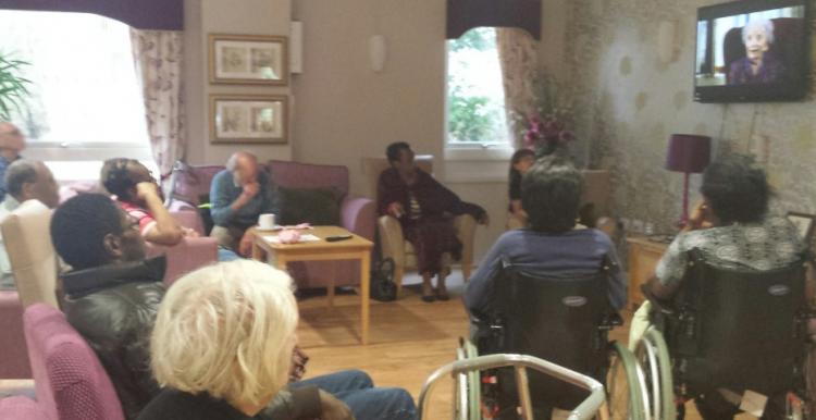 older people sitting in a care home