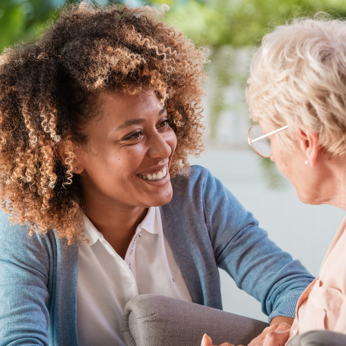 A carer helping an elderly patient