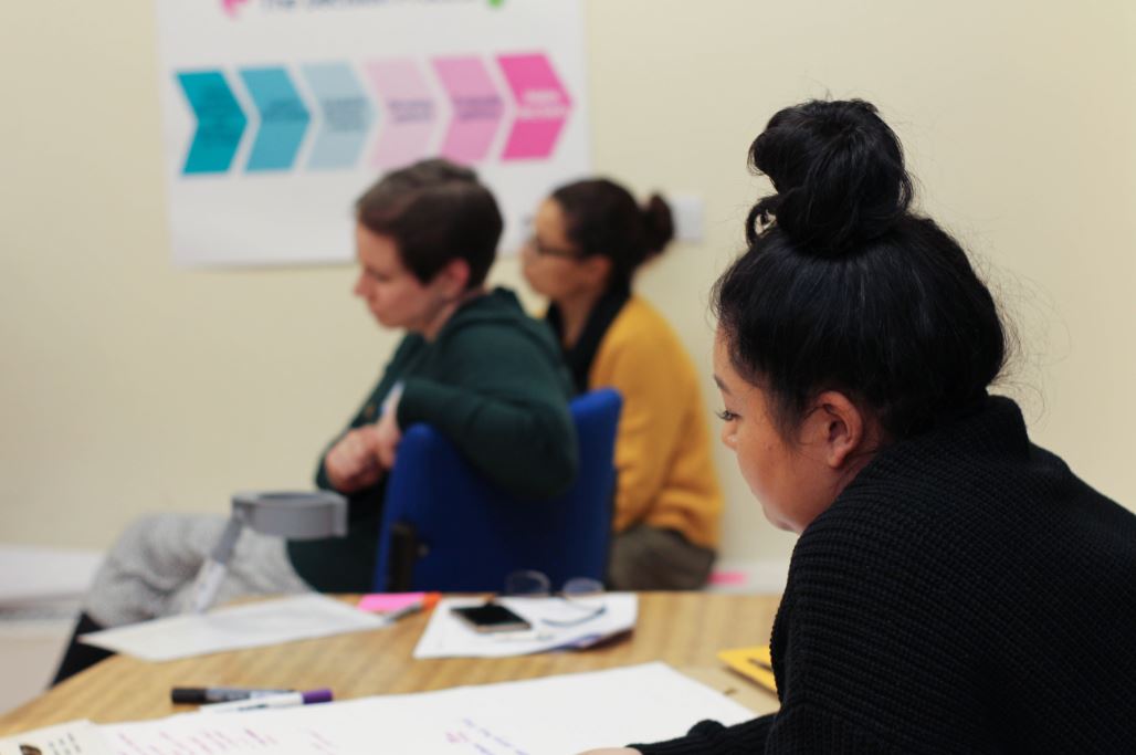 A photo of Louise taking notes