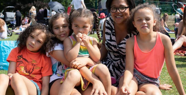 Children and a woman at a picnic 
