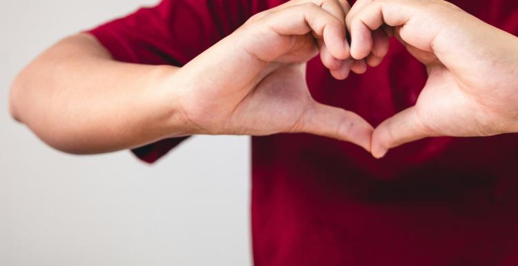 Hands in heart formation.