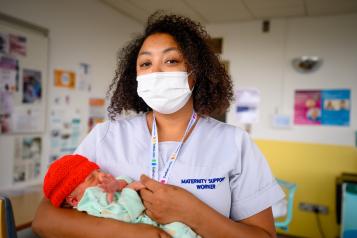 New born baby with maternity support worker