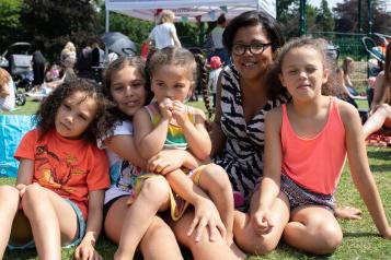 Children and a woman at a picnic 