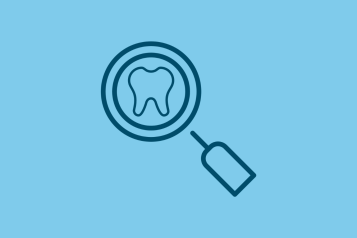 Icon of a magnifying glass and a tooth.