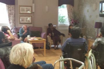 older people sitting in a care home