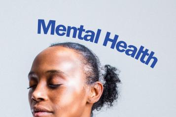 a woman's has her eyes closed and has a serene expression on her face. The words "Mental Health" are hovering above her
