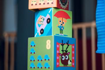 a child stacking cubes 
