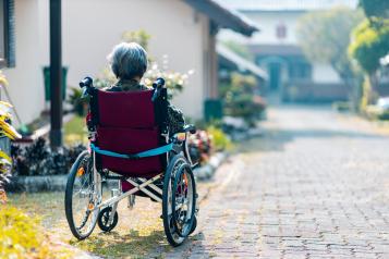an older person sitting in a wheelchair