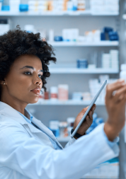 Pharmacist looking at shelf.