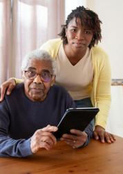 Black woman and older black man smiling