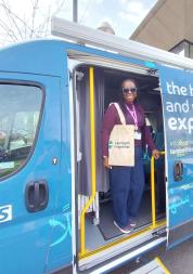 Woman smiling on the Health and Wellbeing bus