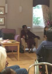 older people sitting in a care home