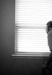 an old man looking out the window