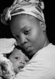 a mother holding her baby