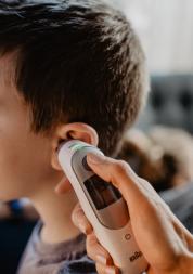 A young boy being checked by the doctor