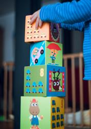 a child stacking cubes 